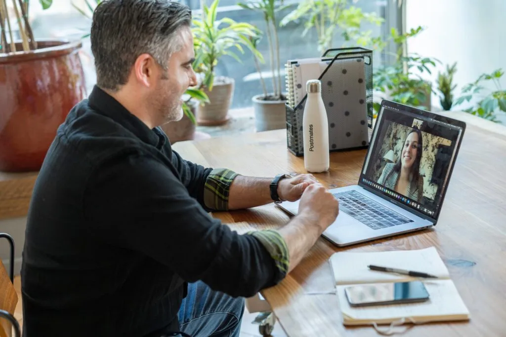 Man on a laptop and a Zoom call